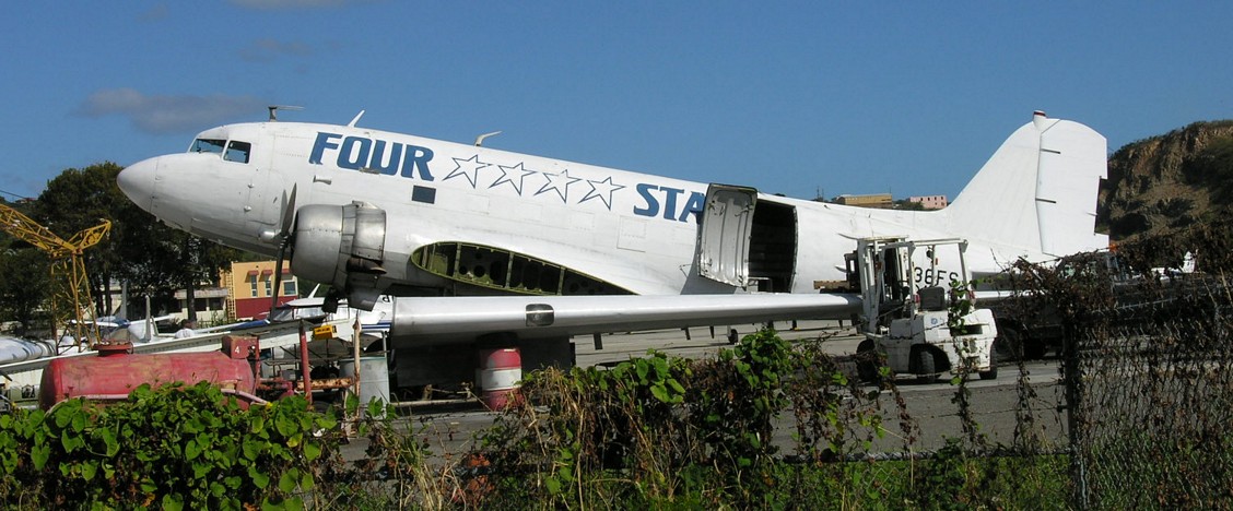 A DC-3 undergoing some repairs [Click for larger picture (1504 &times; 624)]